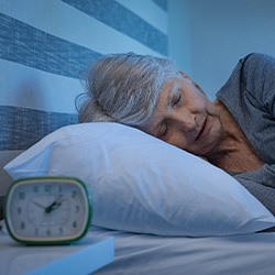 Patient in Lisle sleeping without their dentures