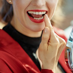 Person admires dental bridge